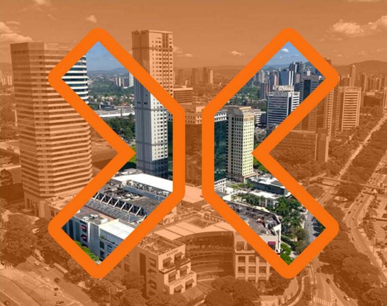 Vista aerea da cidade alaranjada com visão nítida somente dentro do grande X do logotipo da TRIX vazado.