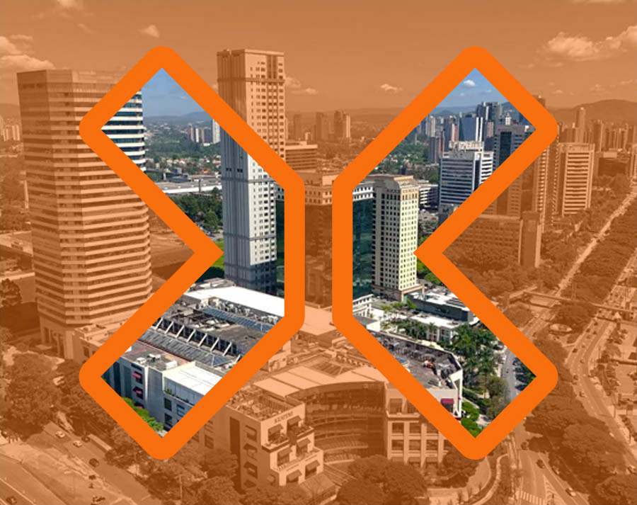 Vista aerea da cidade alaranjada com visão nítida somente dentro do grande X do logotipo da TRIX vazado.